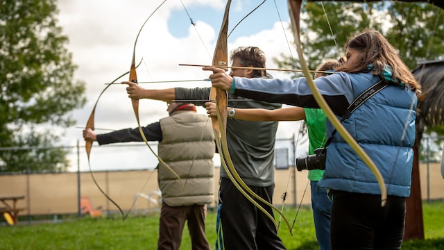 A group trying archery