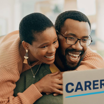 CarerSmart banner. Shows a black couple smiling at a laptop screen