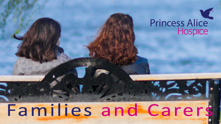 Princess Alice Hospice services for families and carers. Image shows the back of two women sitting on a bench looking out to sea.