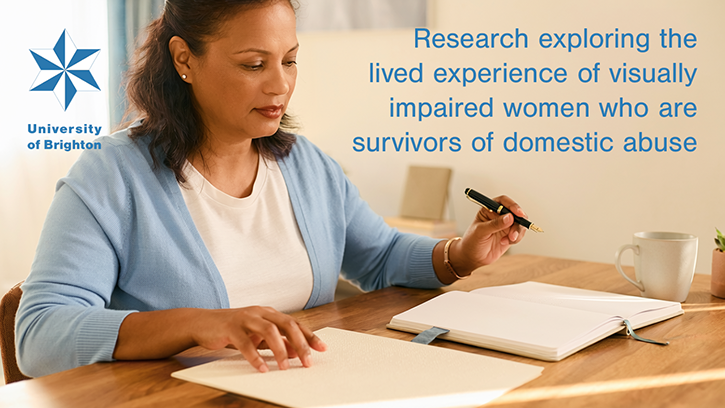 Research exploring the lived experience of visually impaired women who are survivors of domestic abuse from a male partner banner. A shot of a visually impaired woman whose hands are resting on a desk. One hand is gently touching a page of tactile Braille text, while the other holds a classic fountain pen over a blank journal. Soft, natural sunlight streams from the side, creating gentle shadows.