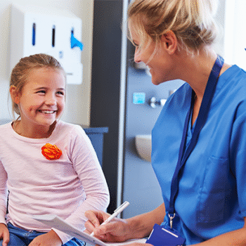 Young carers support service at Kingston Hospital. Image shows a Carers Clinical Liaison Practitioner chatting with a young carer