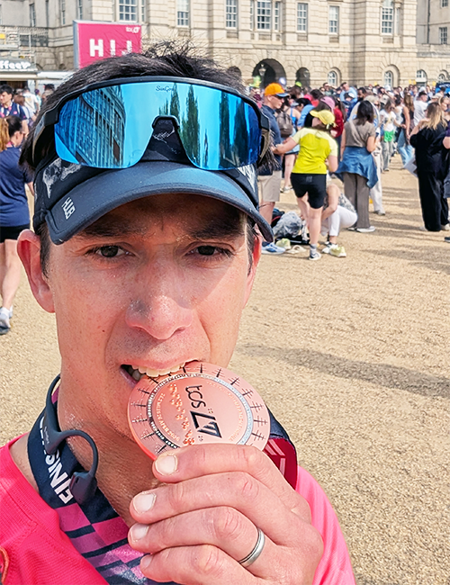 Edouard Guidon celebrates with 2026 London Marathon medal