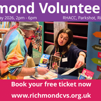 Man in bright coloured jacket and hat talking to stall holder at previous Richmond Volunteer Fair with other stalls and visitors in background – purple header with white text reads ‘Richmond Volunteer Fair, Wednesday 20 May 2026, 2pm – 6pm, RHACC, Parkshot, Richmond, TW9 2RE, white text on red background reads ‘book your free ticket now’, red footer with white text reads ‘Richmond Volunteer Service’ in left corner,’ www.richmondcvs.org.uk’ in centre and white Richmond CVS logo in right corner