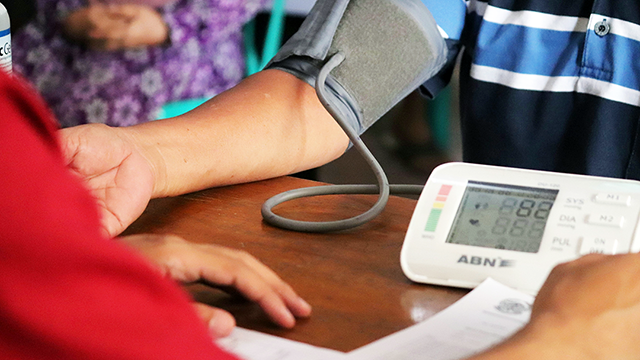 Health Checks – Check In With Yourself. Blood pressure monitor wrapped around someone's arm.