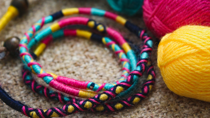 A close-up display of Macrame bracelets, woven into patterns