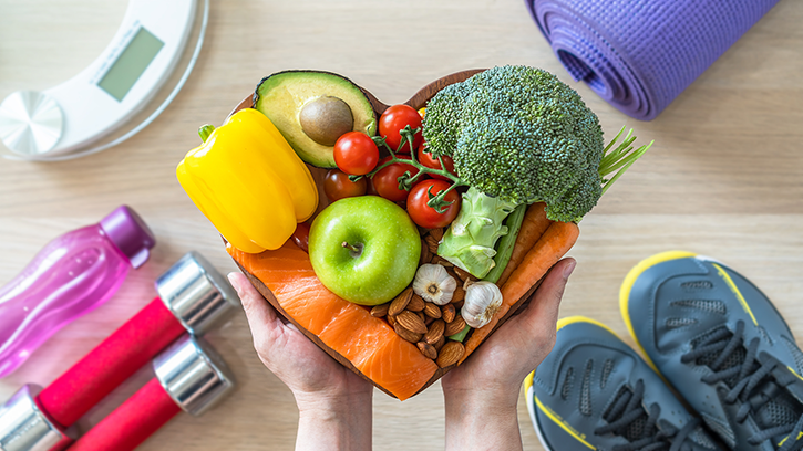 Healthy lifestyle on ketogenic diet, eating clean keto food, good health dietary in heart dish with aerobic body exercise, gym workout training class, weight scale and sports shoes in fitness center
